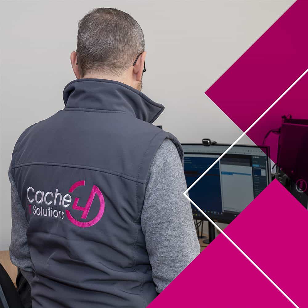 staff member back view with logo jacket