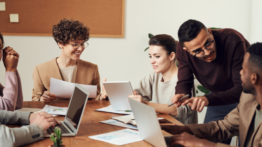 business team around a table identifying  IT Challenges