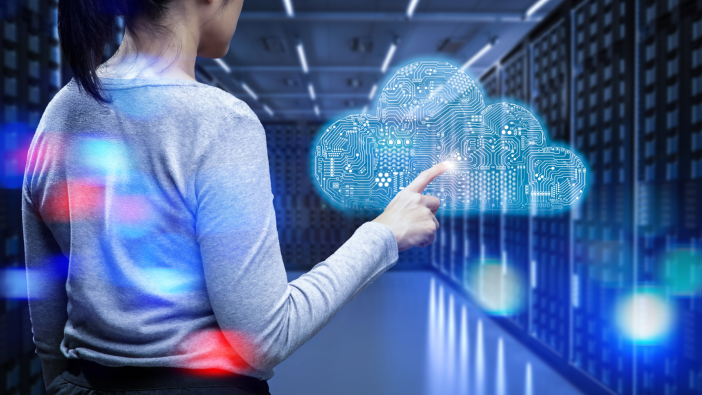 Female standing touching a virtual image Keeping up with technology advancements