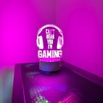 a lit up headphone sign on a gaming pc reading can't hear you i'm gaming
