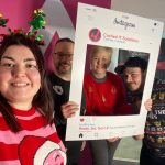the cache4 family - Abigail, Paul, Janet and Bobby holding an instagram sign 